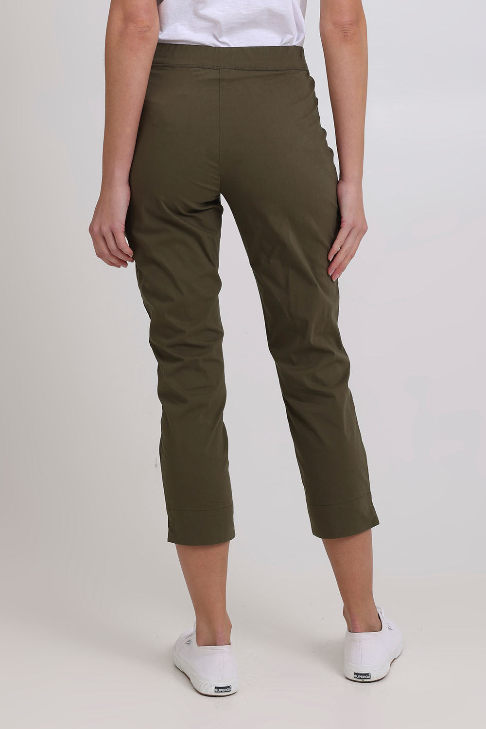 Model Madeline wearing size 10 of the Fuss Free 7/8 Pant in colour Kelp (Green), from the back