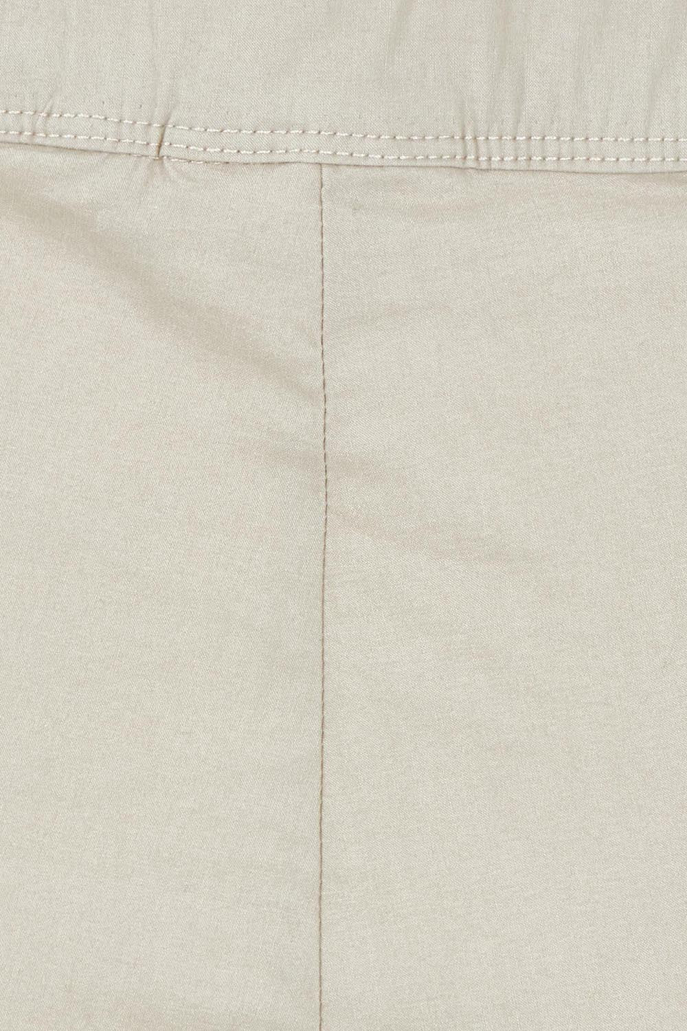 Product shot of the Fuss Free 7/8 Pant in colour Sand, detail