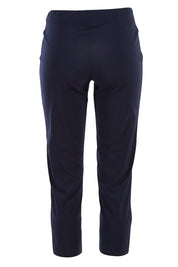 Product shot of the Fuss Free 7/8 Pant in colour TrueNavy (Blue), from the back