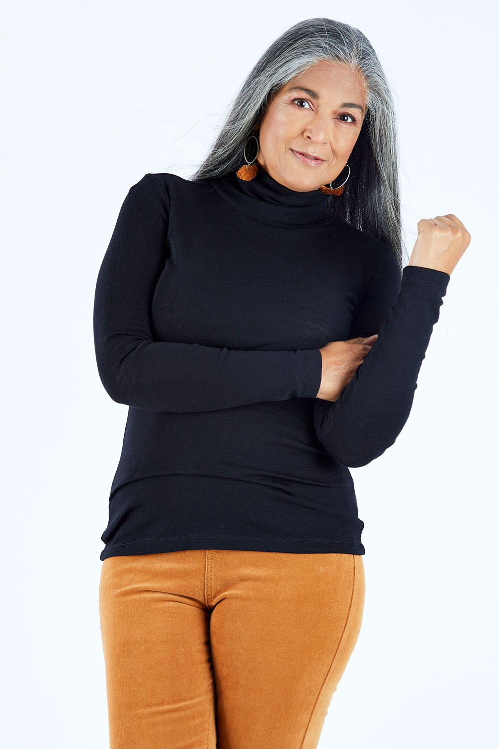 Model Nadine wearing size S of the Pure Merino Rib Polo in colour Black (Black), from the front, cropped image