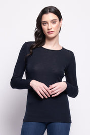 A model wearing the Merino Signature Crew Top in colour Truenavy (Blue), from the front, cropped image