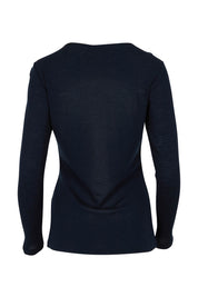 Product shot of the Merino Signature Crew Top in colour Truenavy (Blue), from the back
