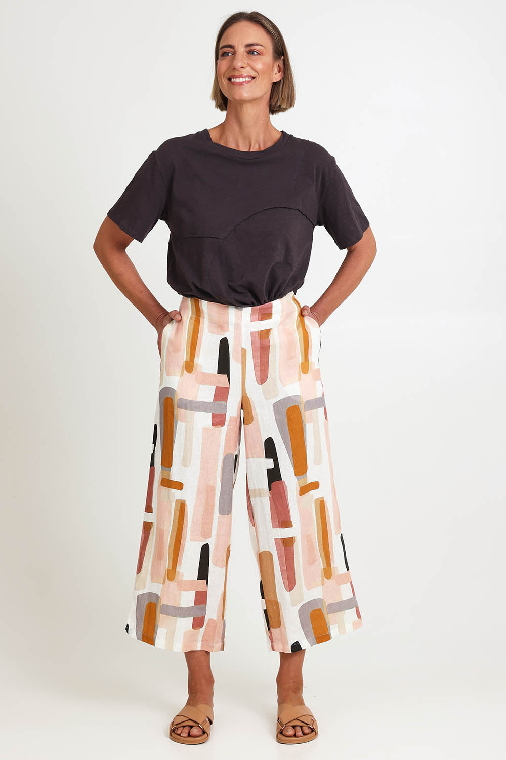 Model Riinar wearing size 10 of the Its Only Natural Pant – Blockart in colour Blockart, from the front