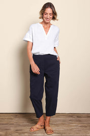 Model Riinar wearing size 10 of the Pump It Up Pant – Navy in colour Navy, from the front