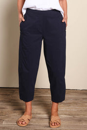 Model Riinar wearing size 10 of the Pump It Up Pant – Navy in colour Navy, from the front