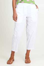 Model Riinar wearing size 10 of the Pump It Up Pant – White in colour White, in a cropped view