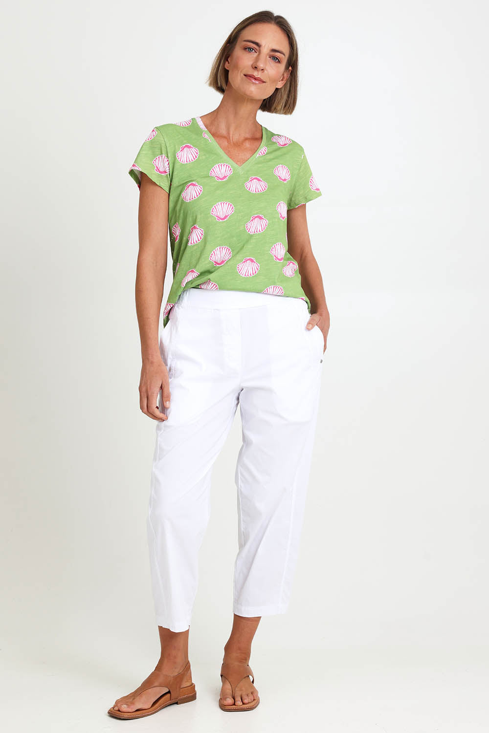 Model Riinar wearing size 10 of the Pump It Up Pant – White in colour White, from the front