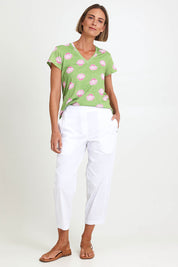 Model Riinar wearing size 10 of the Pump It Up Pant – White in colour White, from the front