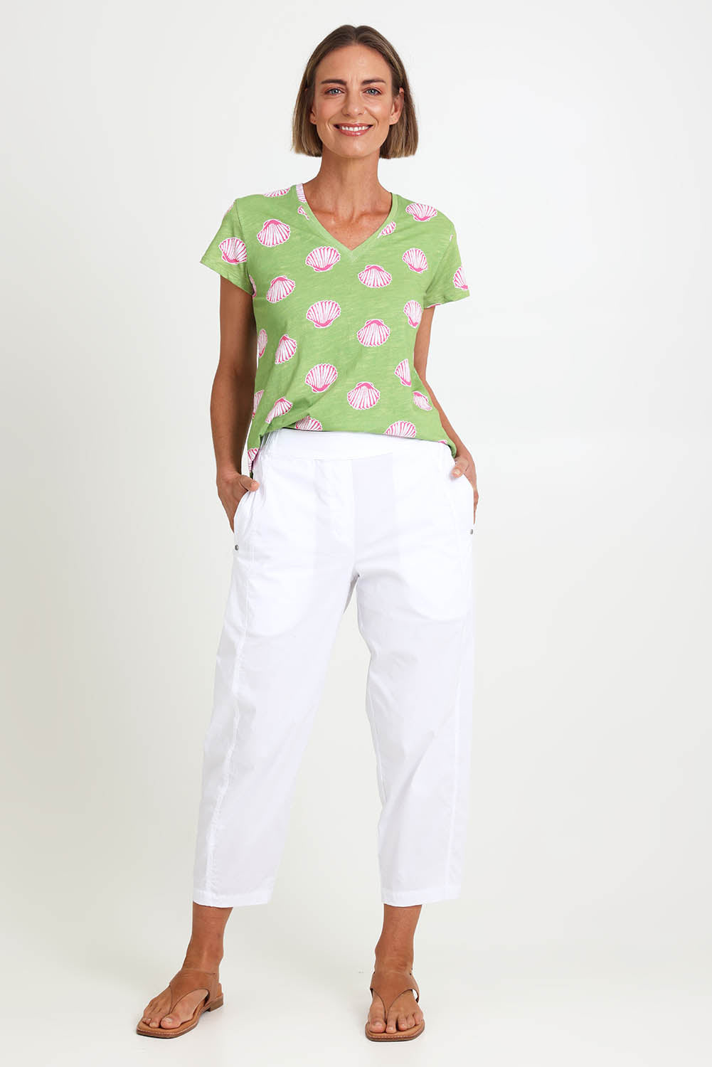 Model Riinar wearing size 10 of the Pump It Up Pant – White in colour White, from the front