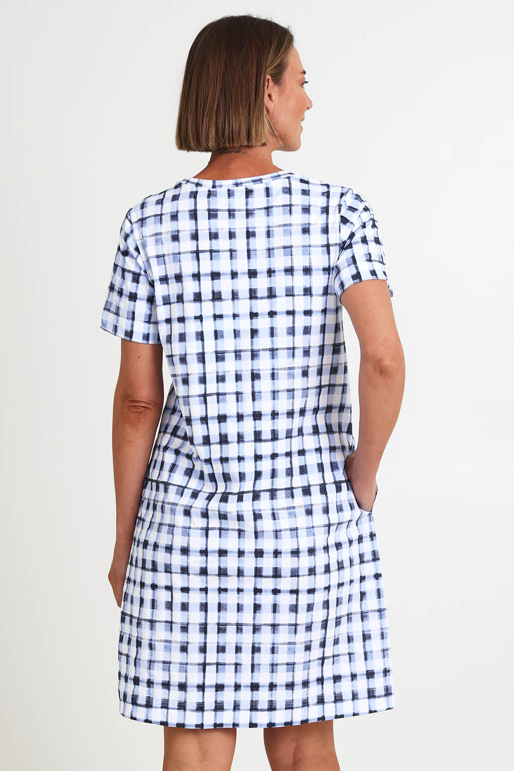 Model Riinar wearing size 10 of the Here Comes Summer Dress – Checkers in colour Checkers, from the back
