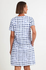 Model Riinar wearing size 10 of the Here Comes Summer Dress – Checkers in colour Checkers, from the back
