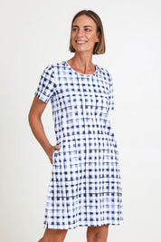 Model Riinar wearing size 10 of the Here Comes Summer Dress – Checkers in colour Checkers, in a cropped view