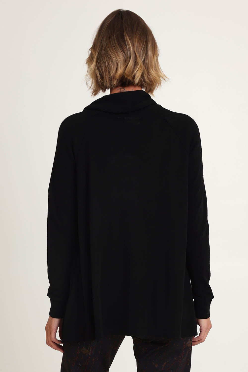 Model Riina wearing size S of the Good Stakes Top in colour Black (Black), from the back