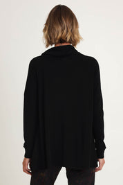 Model Riina wearing size S of the Good Stakes Top in colour Black (Black), from the back