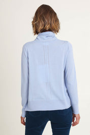 Model Riina wearing size S of the Detail Driven Sweater in colour Articblue (Blue), from the back