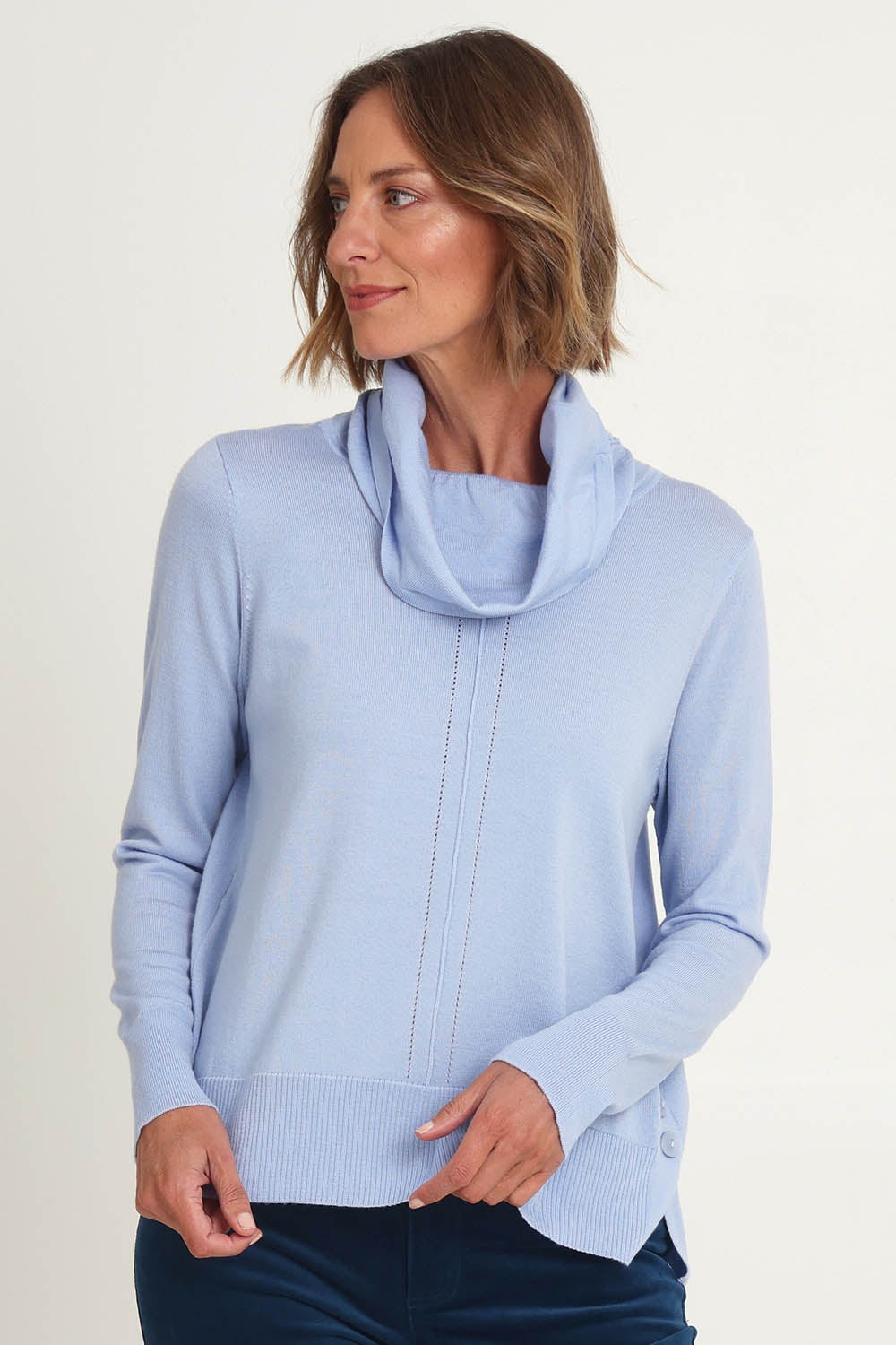 Model Riina wearing size S of the Detail Driven Sweater in colour Articblue (Blue), from the front, cropped image