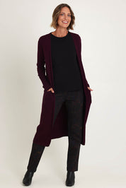 Model Riina wearing size S of the Luxe Line Cardi in colour Cherry (Purple), from the front, showing the whole outfit