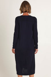 Model Riina wearing size S of the Upper Cut Dress in colour Nightsky (Blue), from the back