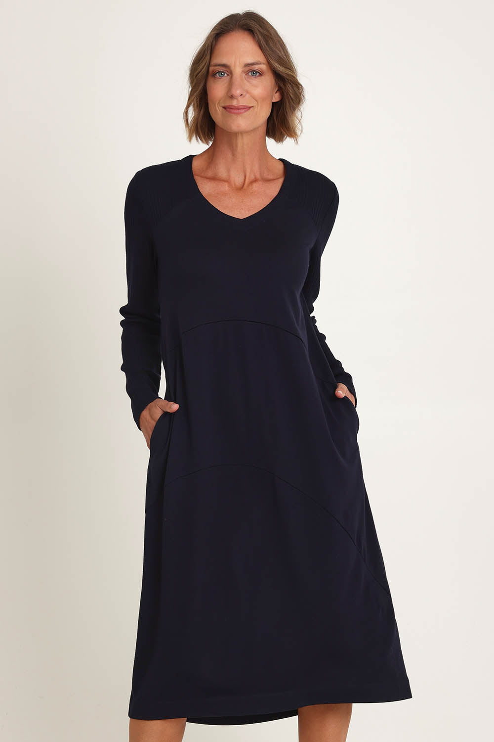 Model Riina wearing size S of the Upper Cut Dress in colour Nightsky (Blue), from the front, cropped image