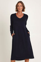 Model Riina wearing size S of the Upper Cut Dress in colour Nightsky (Blue), from the front, cropped image