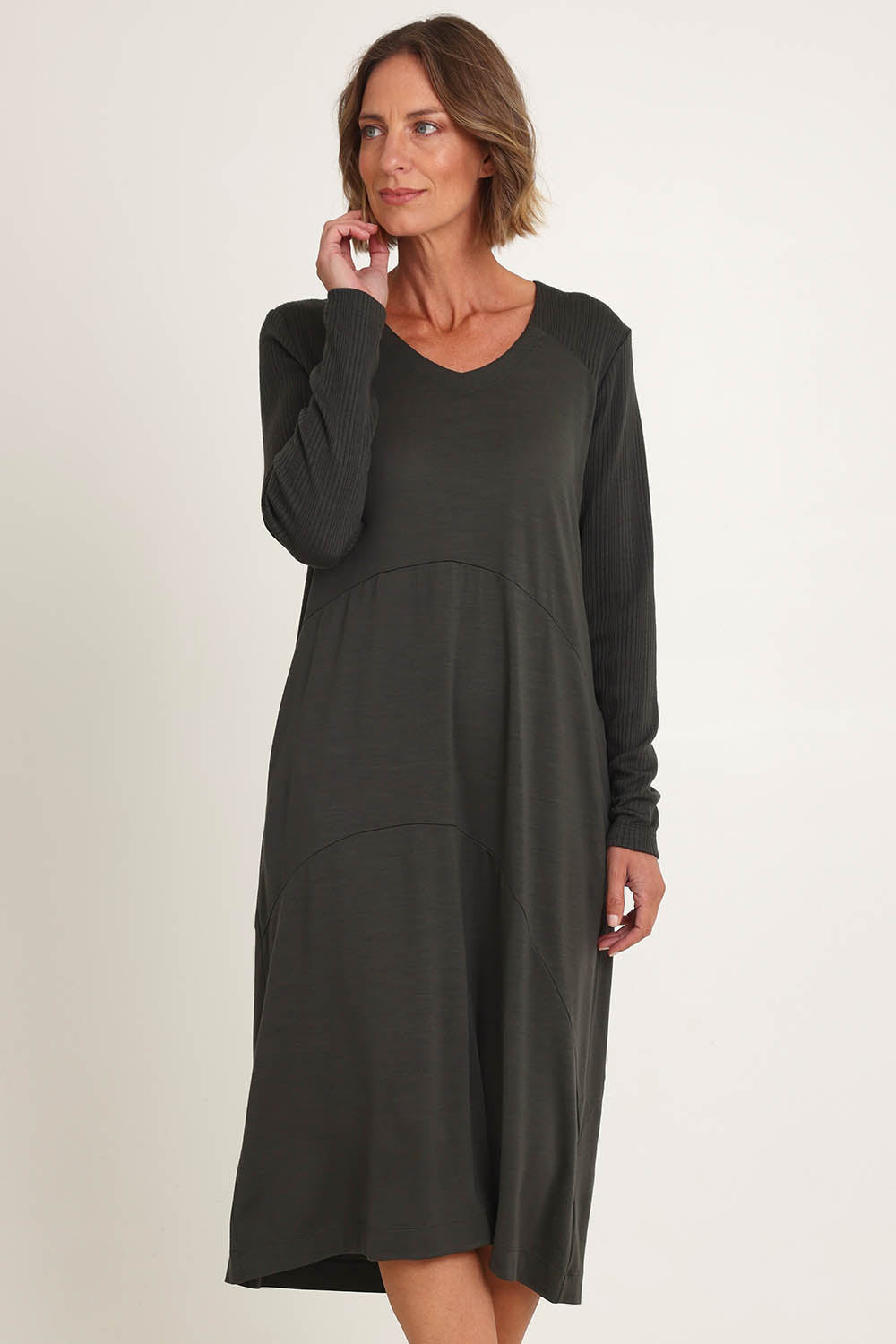 Model Riina wearing size S of the Upper Cut Dress in colour Olive (Green), from the front, cropped image