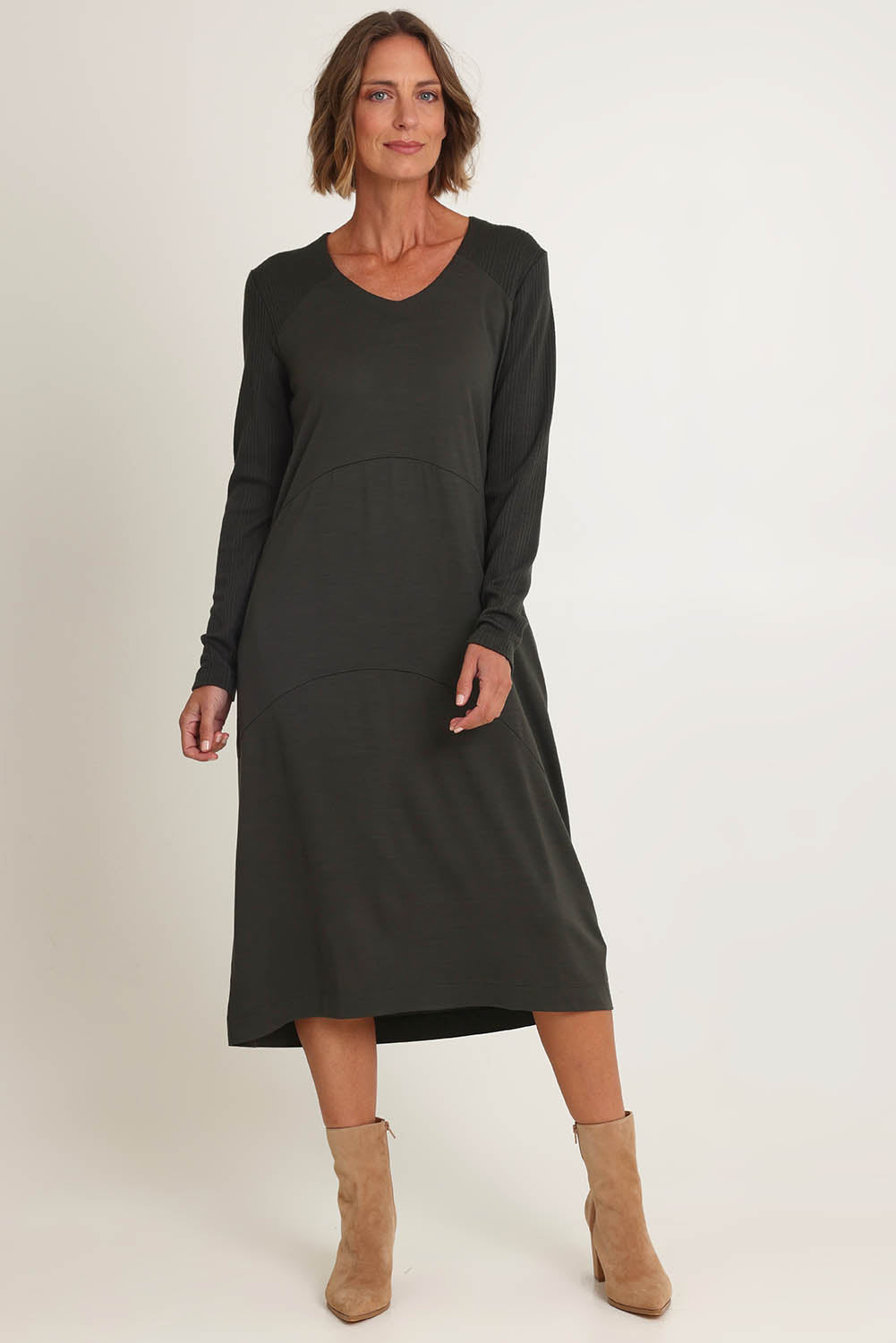 Model Riina wearing size S of the Upper Cut Dress in colour Olive (Green), from the front, showing the whole outfit