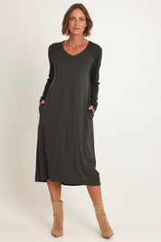 Model Riina wearing size S of the Upper Cut Dress in colour Olive (Green), from the front, showing the whole outfit