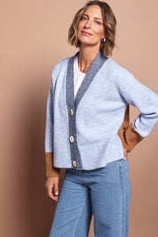 Model Riina wearing size S of the Plush Love Cardi in colour Bluecombo (Blue), from the front, showing the whole outfit