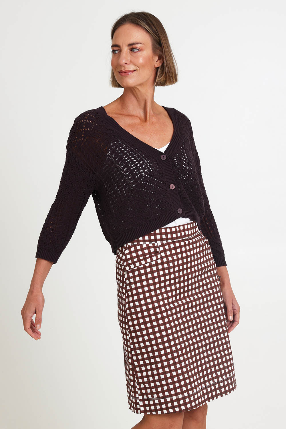 Model Riinar wearing size 10 of the Hooked On You Cardigan – Sable in colour Sable, from an angle