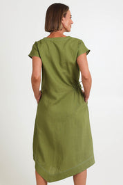 Model Riinar wearing size 10 of the Point Of View Dress – Avocado in colour Avocado, from the back