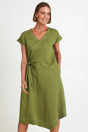 Model Riinar wearing size 10 of the Point Of View Dress – Avocado in colour Avocado, in a cropped view
