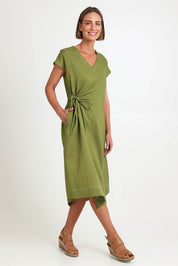 Model Riinar wearing size 10 of the Point Of View Dress – Avocado in colour Avocado, from the front