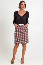 Model Riinar wearing size 10 of the Tee Riffic Skirt – Checkit in colour Checkit, from the front