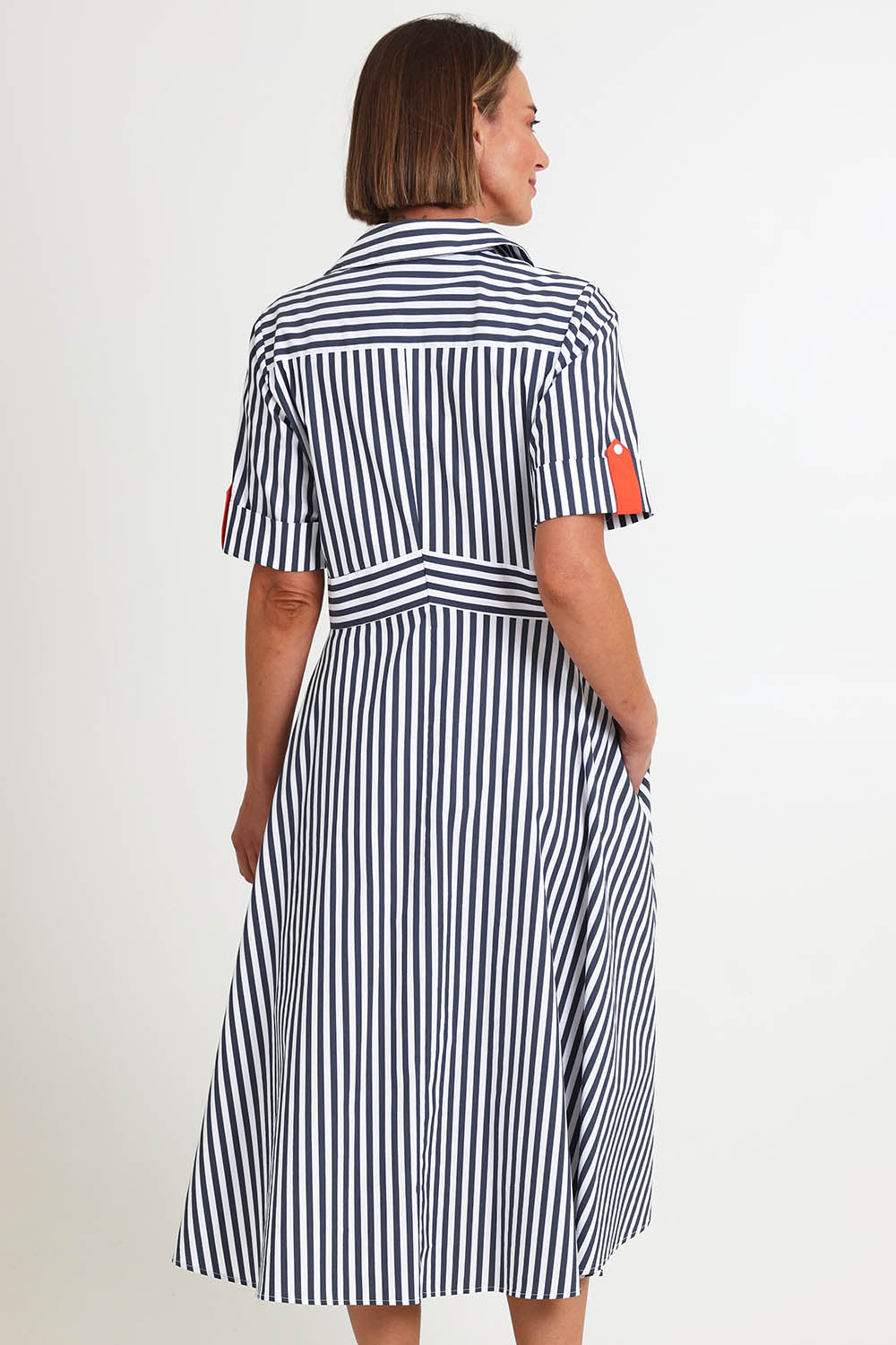 Model Riinar wearing size 10 of the On Point Dress – Navytang in colour Navytang, from the back