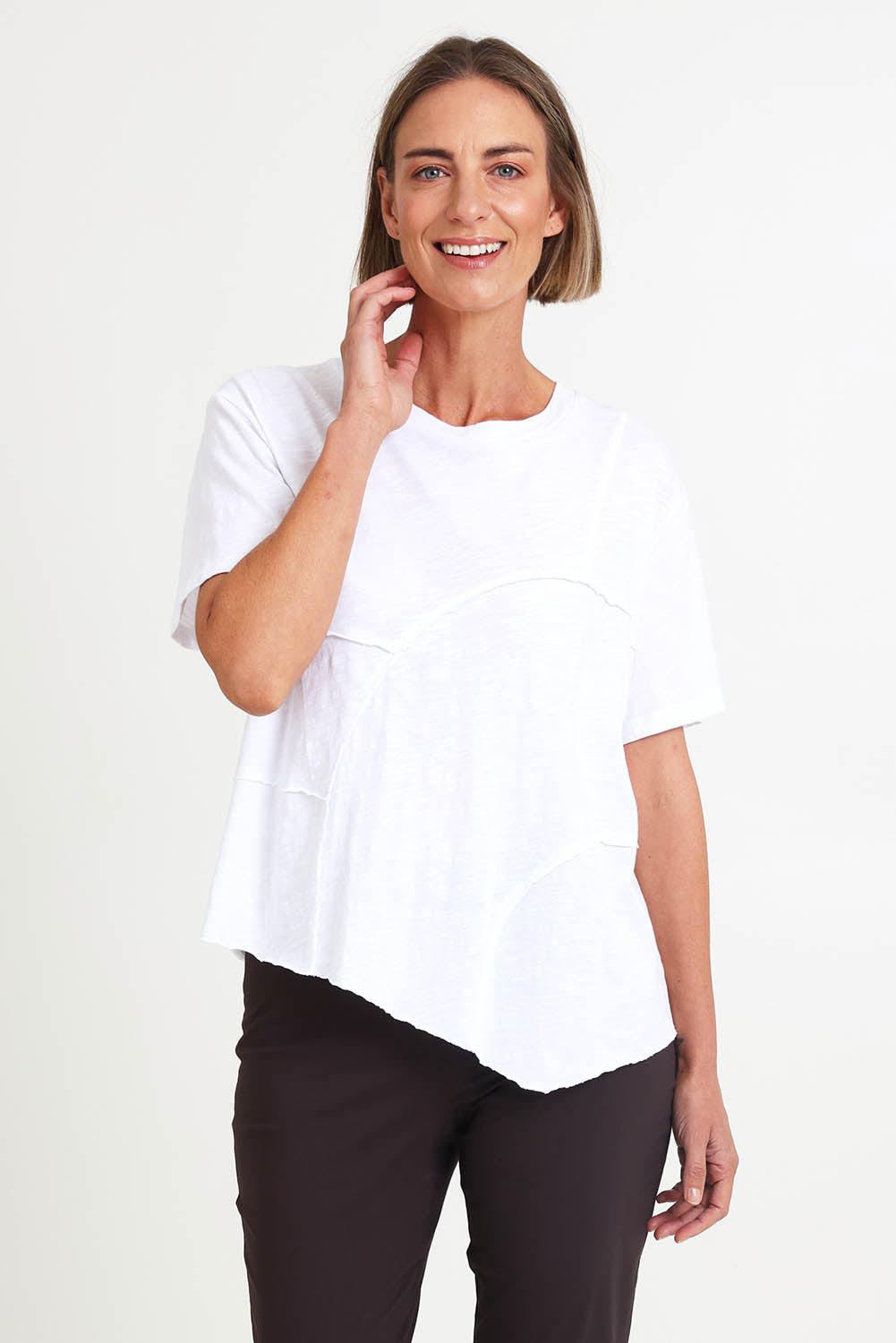 Model Riinar wearing size 10 of the Spliced And Diced Tee – White in colour White, in a cropped view
