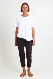 Model Riinar wearing size 10 of the Spliced And Diced Tee – White in colour White, from the front