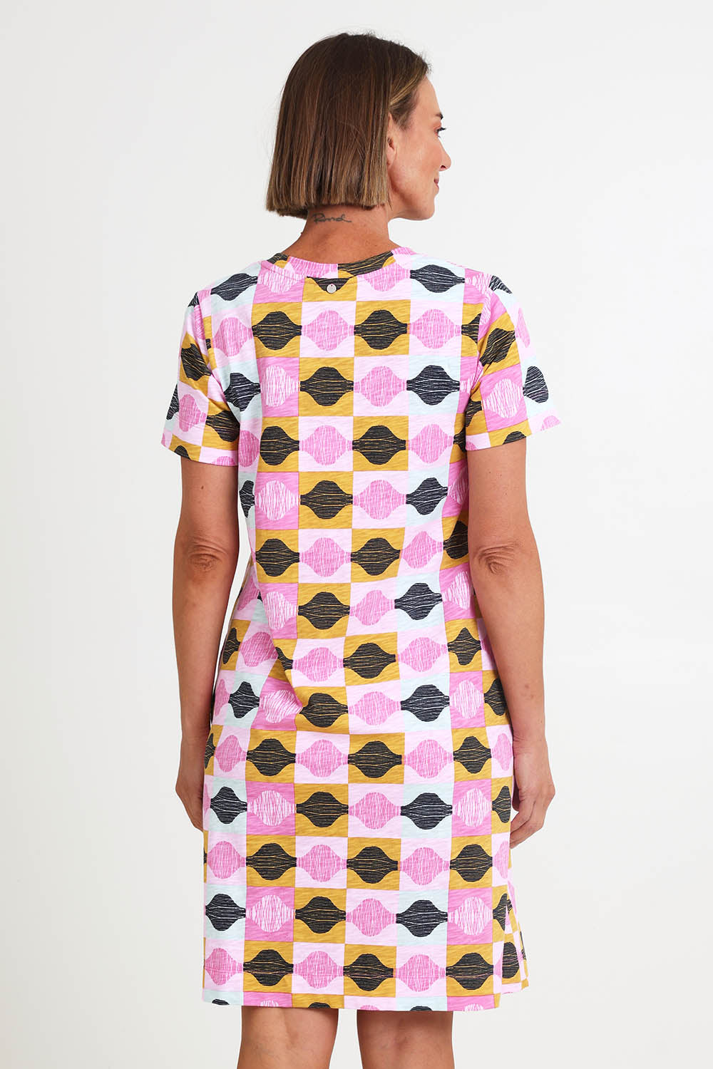 Model Riinar wearing size 10 of the Oh Frock Dress – Rhythm in colour Rhythm, from the back