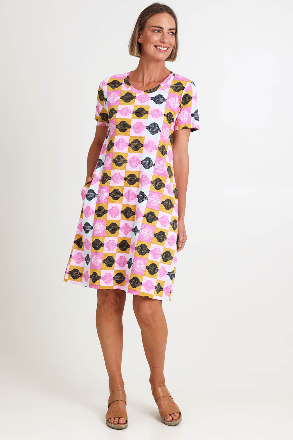 Model Riinar wearing size 10 of the Oh Frock Dress – Rhythm in colour Rhythm, from the front