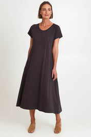 Model Riinar wearing size 10 of the Seamingly Good Dress – Sable in colour Sable, from the front