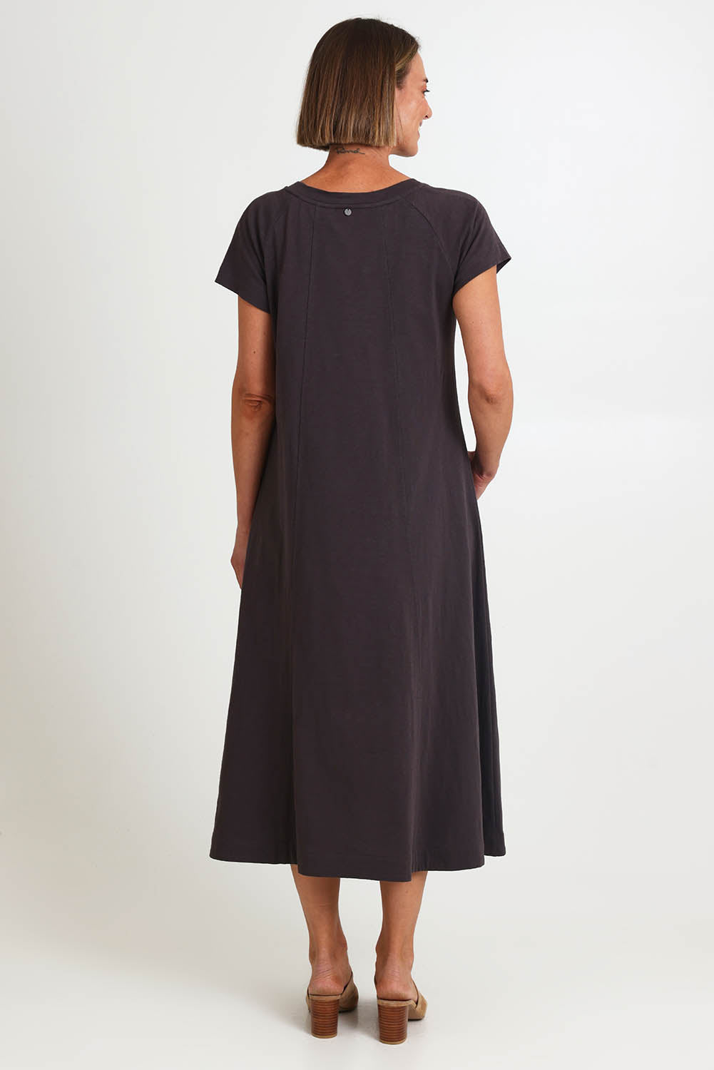 Model Riinar wearing size 10 of the Seamingly Good Dress – Sable in colour Sable, from the front