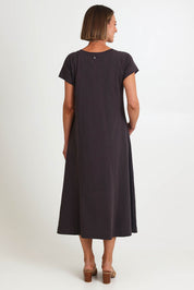 Model Riinar wearing size 10 of the Seamingly Good Dress – Sable in colour Sable, from the front
