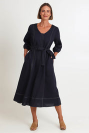 Model Riinar wearing size 10 of the Shout Out Dress – Gunsmoke in colour Gunsmoke, from the front