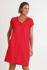 Model Riinar wearing size 10 of the V Festival Dress – Melon in colour Melon, from an angle