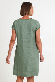 Model Riinar wearing size 10 of the V Festival Dress – Sage in colour Sage, from the back