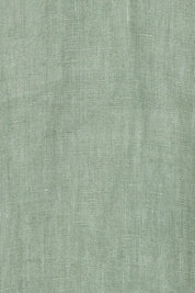Product shot of the V Festival Dress – Sage in colour Sage, showing detail