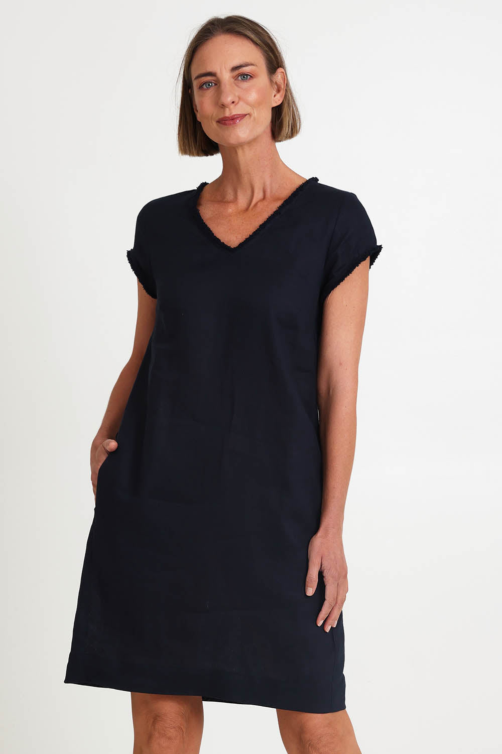 Model Riinar wearing size 10 of the V Festival Dress – Truenavy in colour Truenavy, in a cropped view