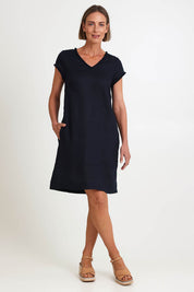 Model Riinar wearing size 10 of the V Festival Dress – Truenavy in colour Truenavy, from the front