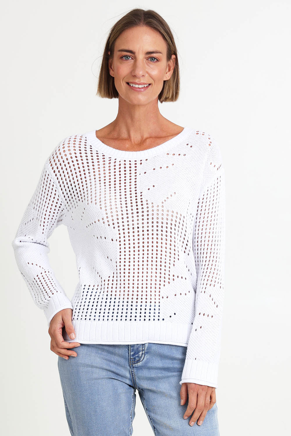 Model Riinar wearing size 10 of the Breeze Easy Sweater – White in colour White, in a cropped view