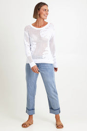 Model Riinar wearing size 10 of the Breeze Easy Sweater – White in colour White, from the front
