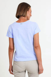 Model Riinar wearing size 10 of the Intersection Cotton Tee – Sky in colour Sky, from the back
